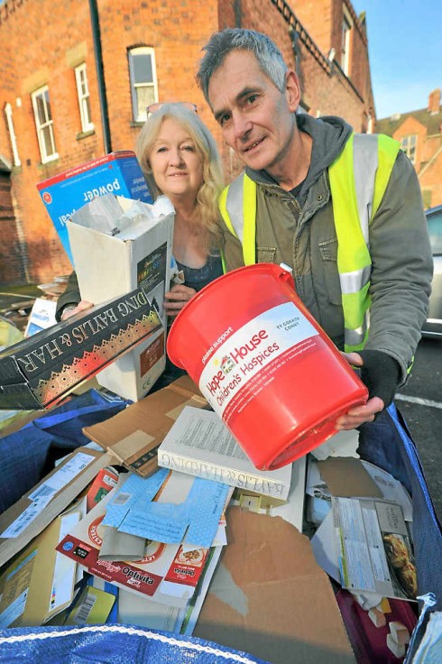 Transition Town Shrewsbury volunteers Margaret Bowman and Howard Hutchings help with the cardboard recycling.  Pic: Shropshire Star.  