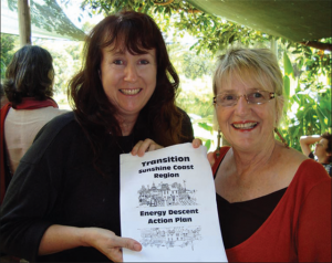 Sonya Wallace (L) and Janet Millington with the Sunshine Coast Energy Descent Action Plan. 