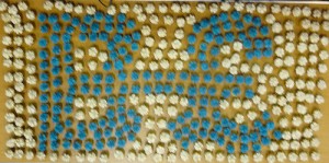 The Brixton Pound symbol made up in small iced cakes