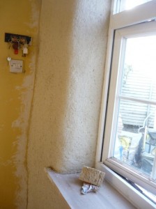 Hemp lime plaster being applied to the uninsulated kitchen wall; it has made some difference, but it can't work miracles....